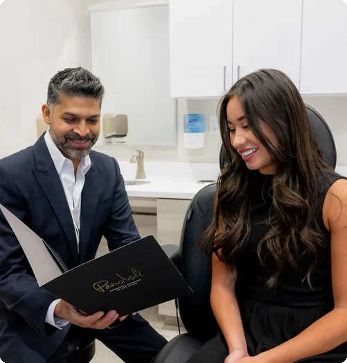Dr. Pancholi reviewing a surgical plan with a patient